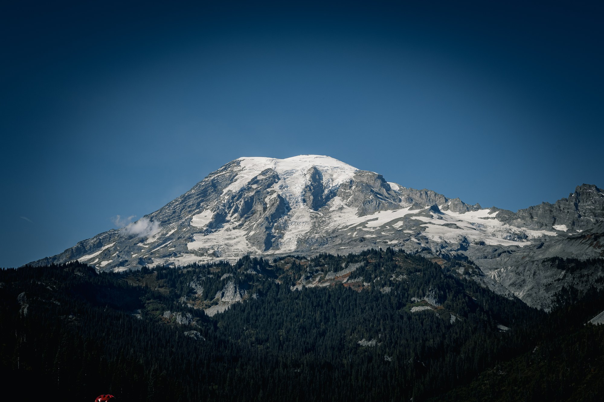 Snow-capped mountain under blue sky